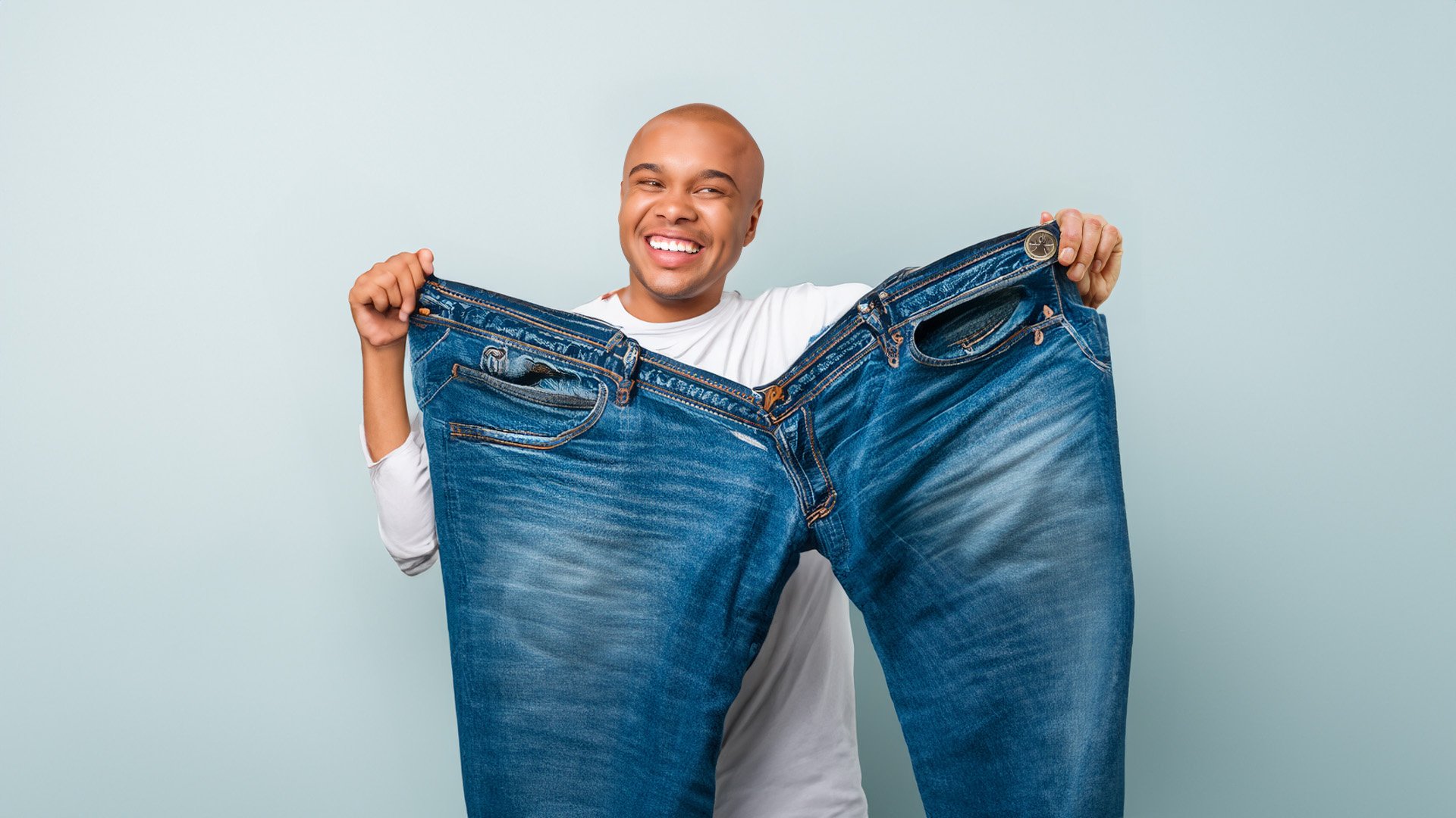 Man holding large pants